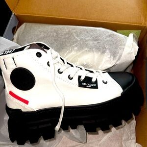 Black and white palladium boots. Brand NEW. Never worn. Fresh out the box.